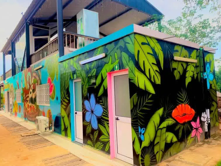 Tropical floral mural on the resort building exterior